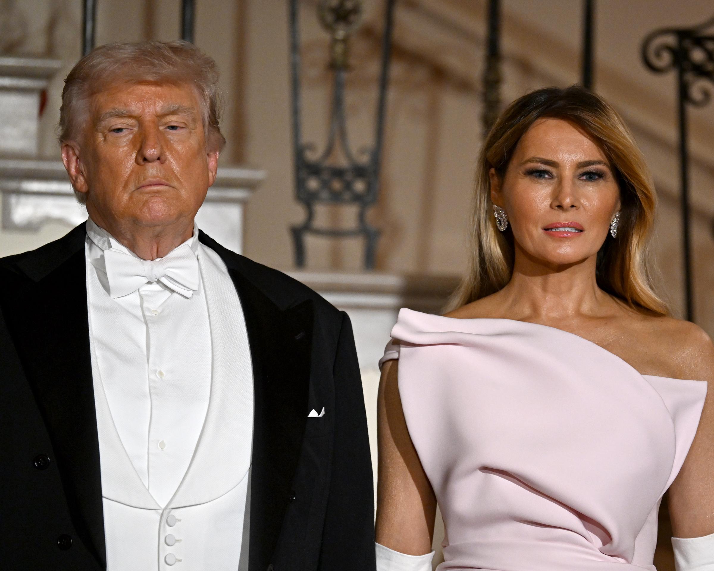 Donald and Melania Trump pose outside during an official state dinner hosted at The White House on day two of the State Visit of King Charles III and Queen Camilla to the US, on April 28, 2026 in Washington, DC | Source: Getty Images