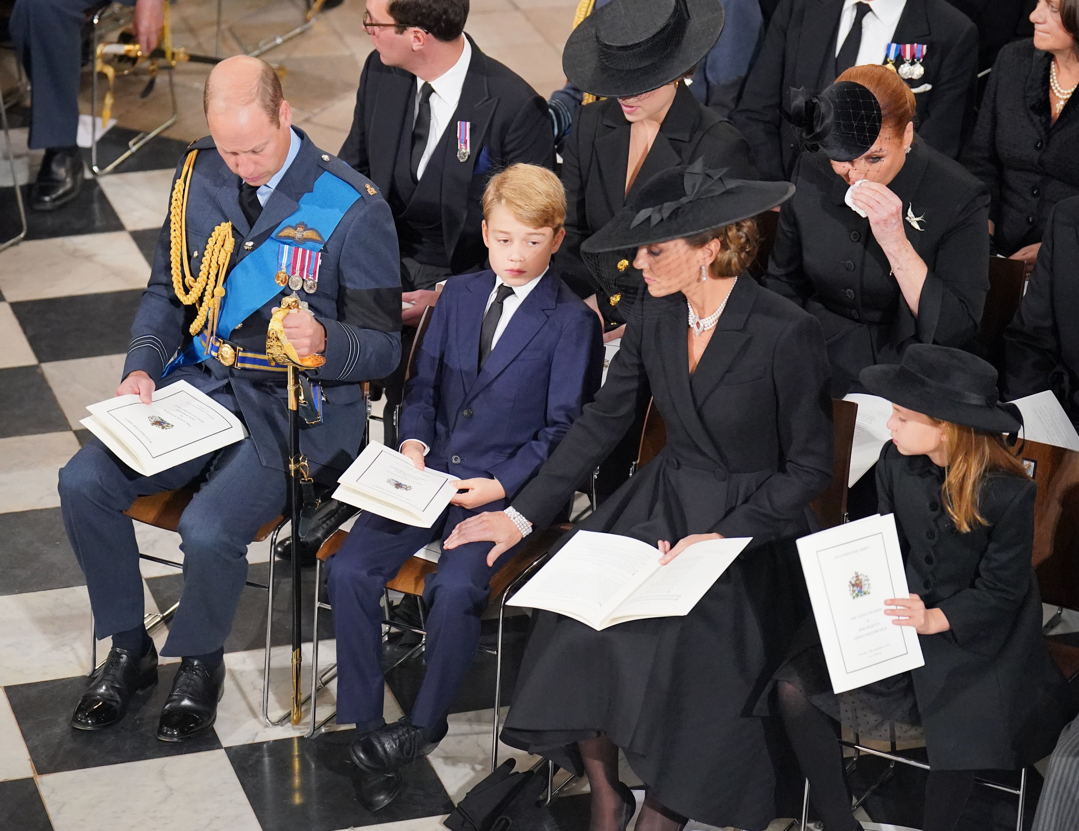 Prince William, Prince George, Princess Kate, and Princess Charlotte in front of the coffin during the State Funeral of Queen Elizabeth II at Westminster Abbey on September 19, 2022, in London, England | Source: Getty Images