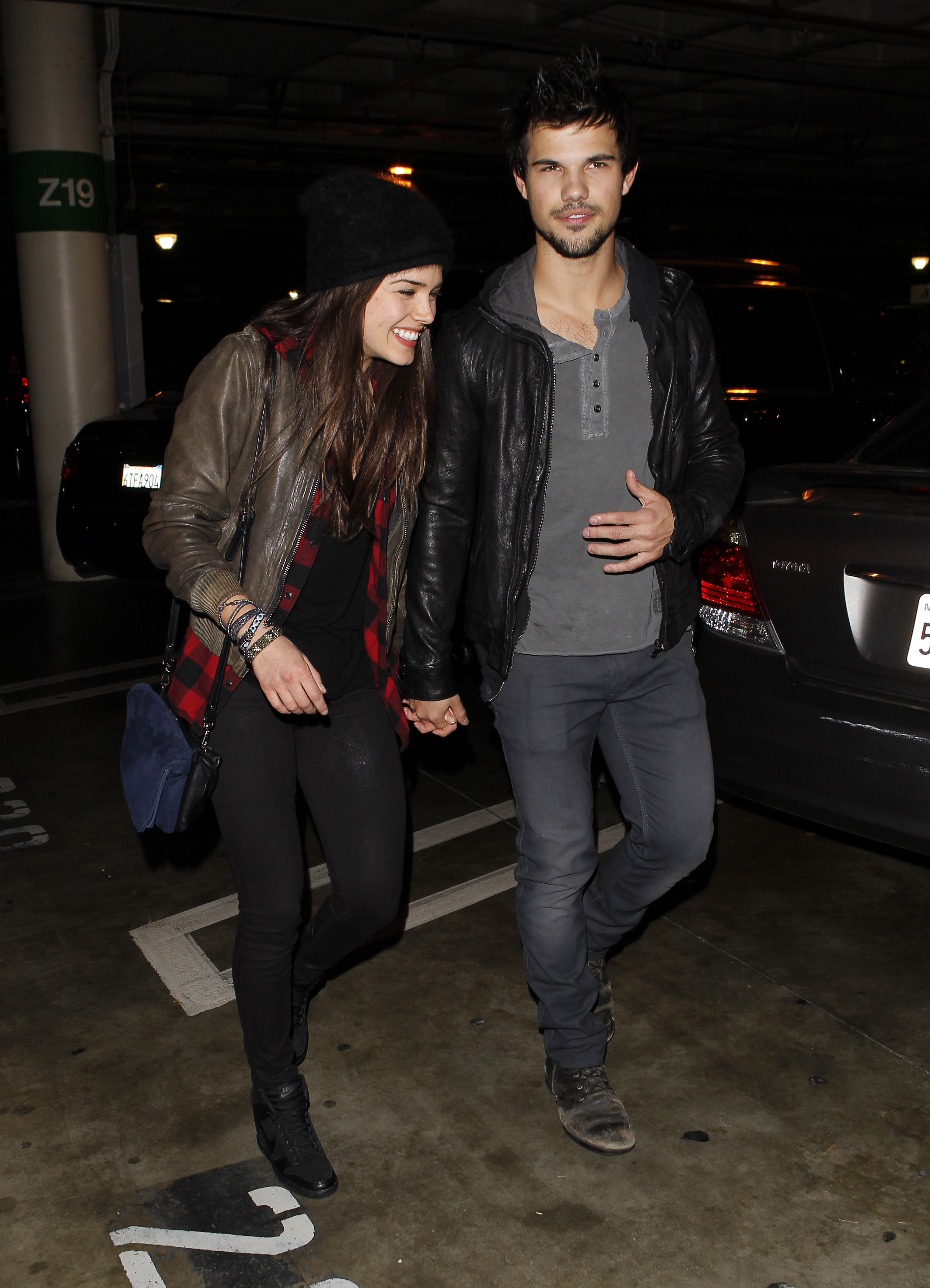 Taylor Lautner and Marie Avgeropoulos are seen on December 9, 2013, in Los Angeles, California. | Source: Getty Images