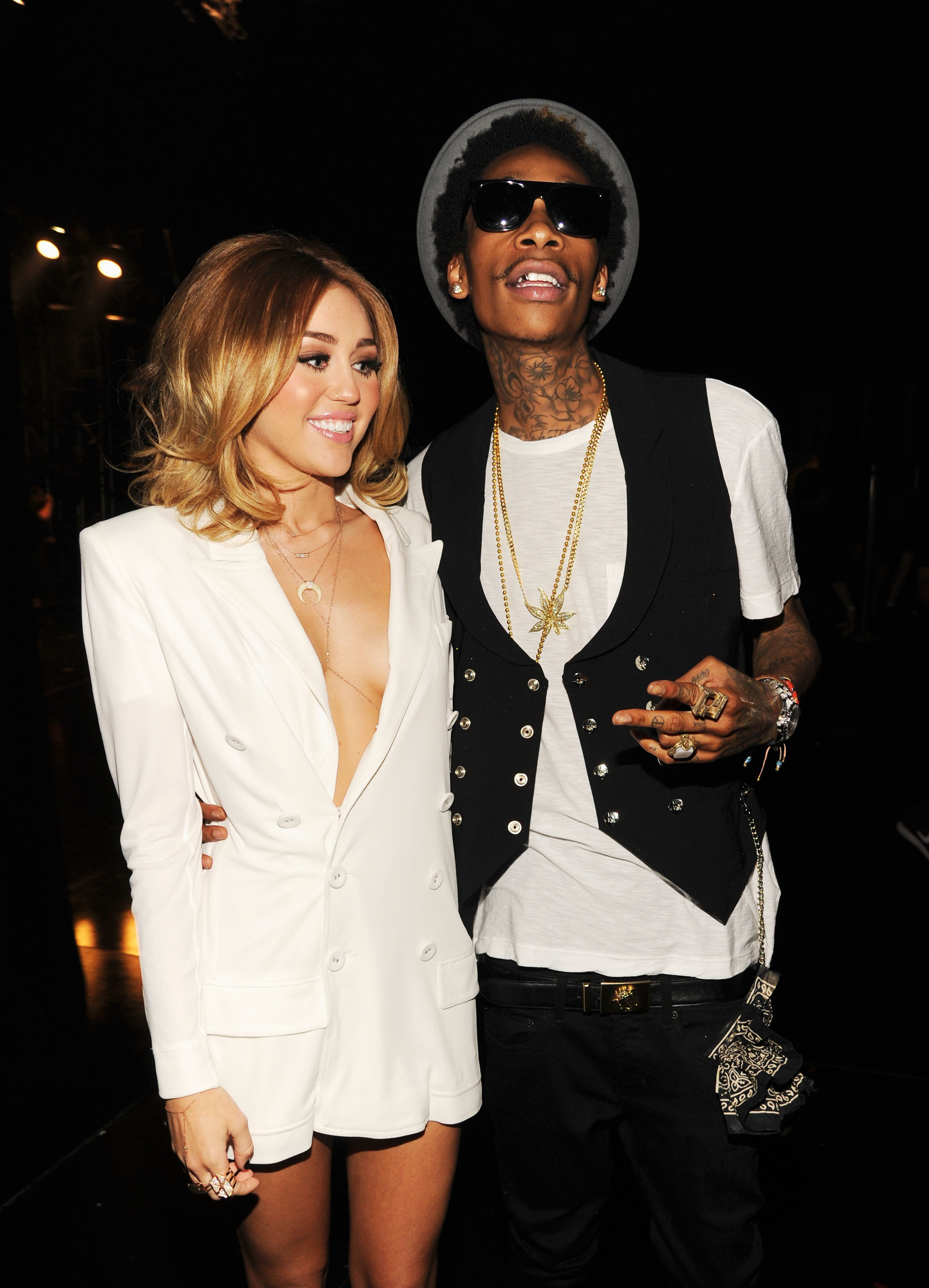 Miley Cyrus and Wiz Khalifa backstage at the 2012 Billboard Music Awards on May 20 in Las Vegas, Nevada. | Source: Getty Images
