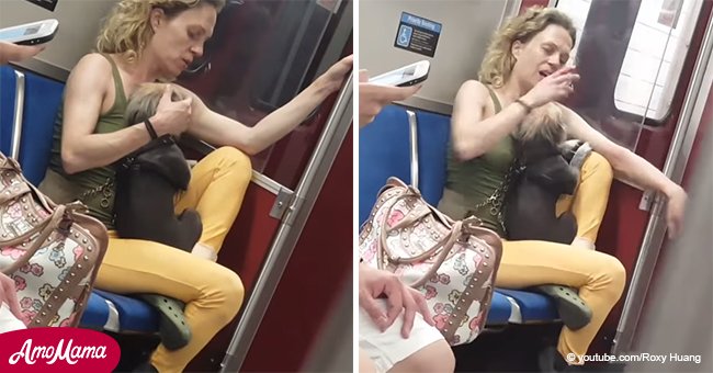 Cruel woman caught hitting and biting her dog on a train (video)