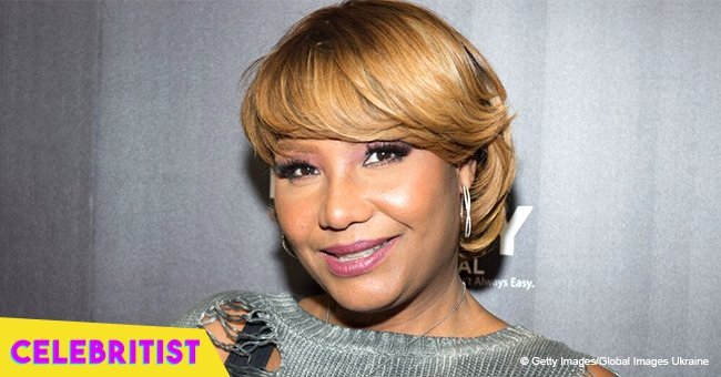 Traci Braxton stuns in glittery black jumpsuit after becoming a grandma for the 1st time