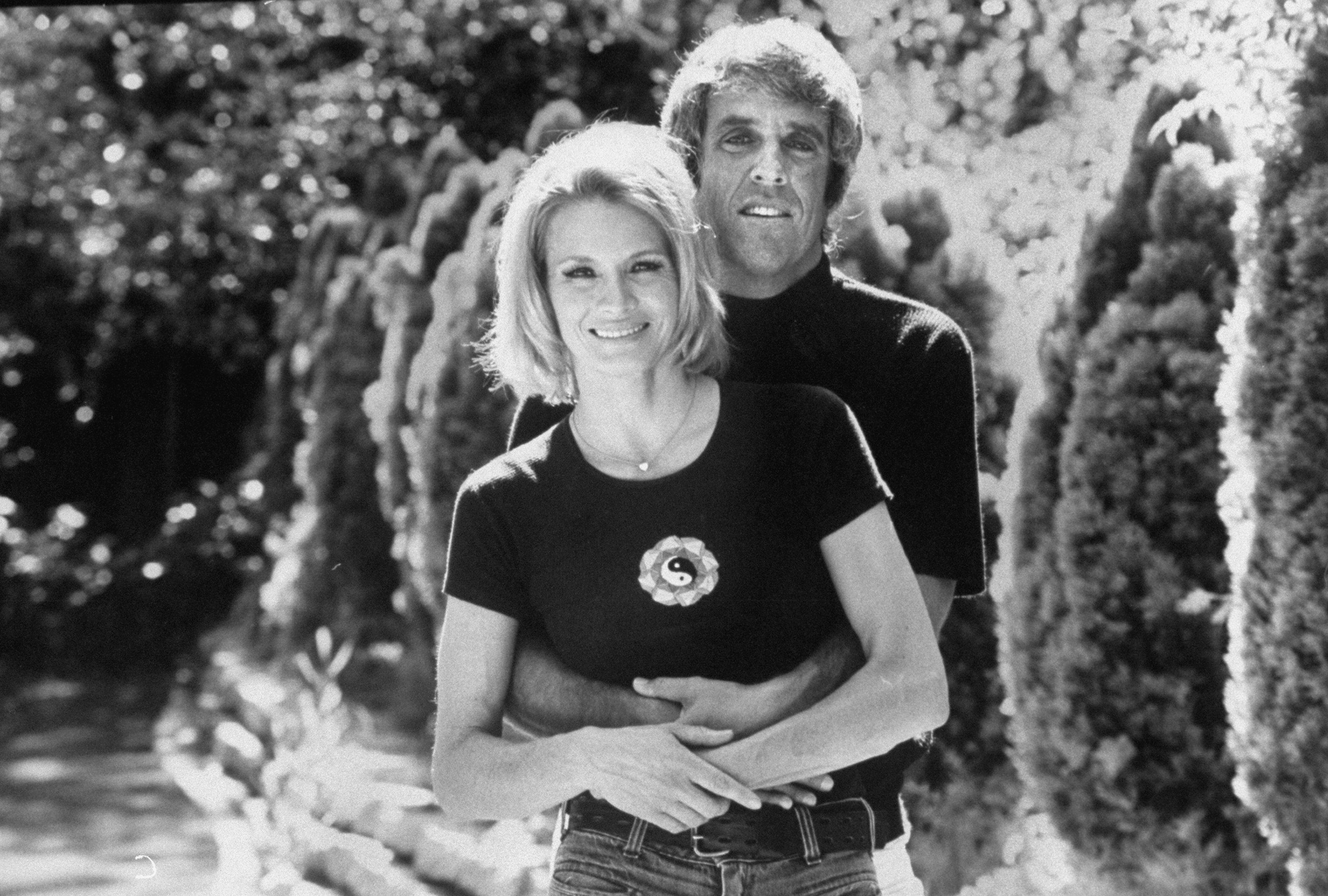 Burt Bacharach and Angie Dickinson posing for a photo in Beverly Hills in 1974 | Source: Getty Images