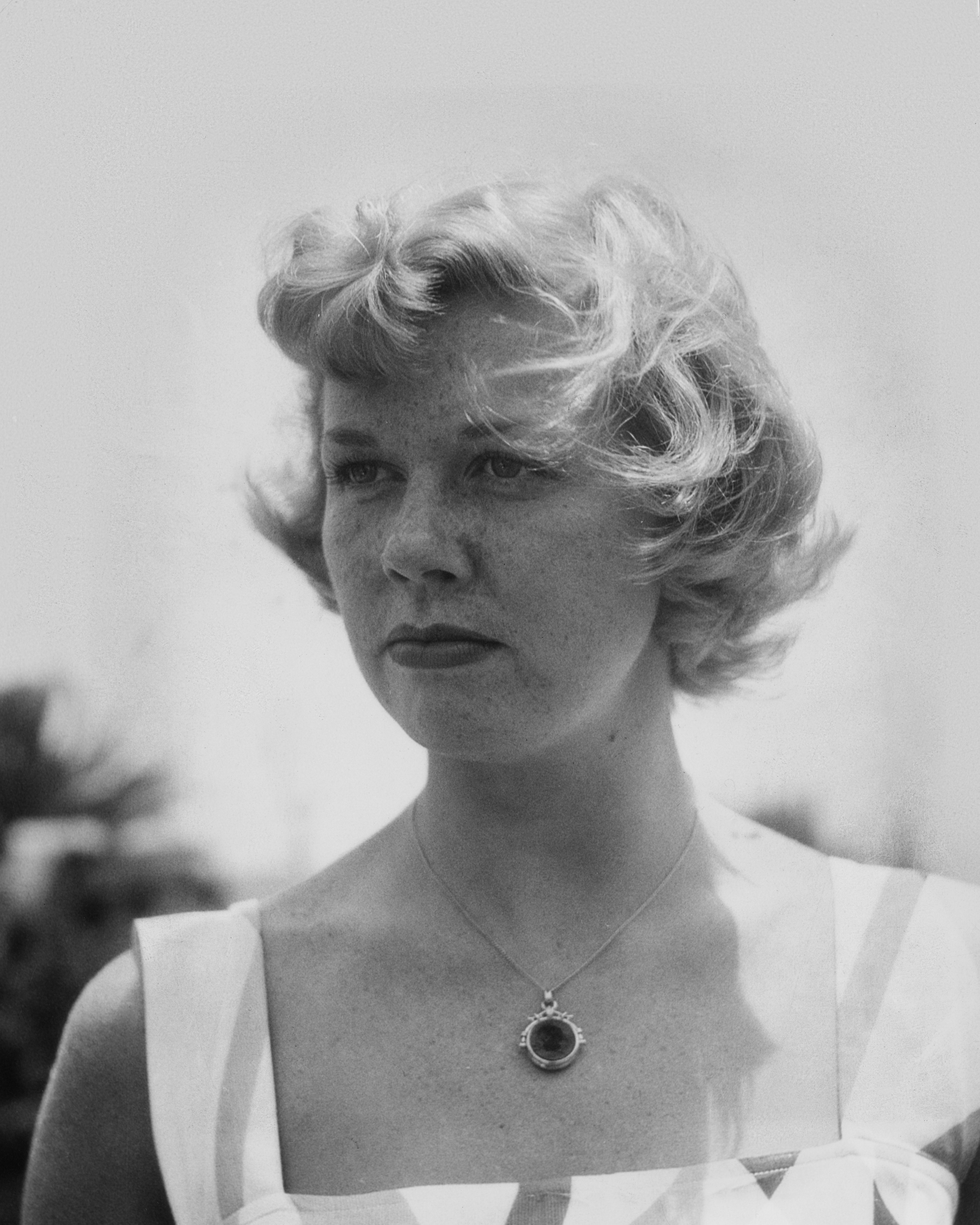 Doris Day pictured looking sad with her curled up blonde short hair in 1949. / Source: Getty Images