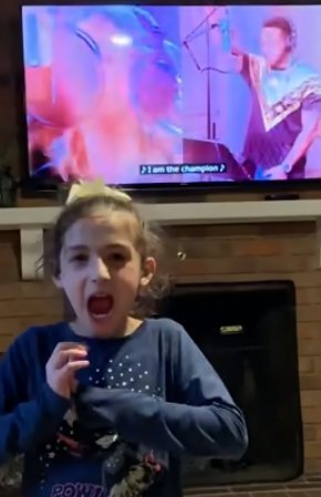 Savannah Dahan rocking out to "The Champion" by Carried Underwood feat. Ludacris. | Source: YouTube/Savvy ASL