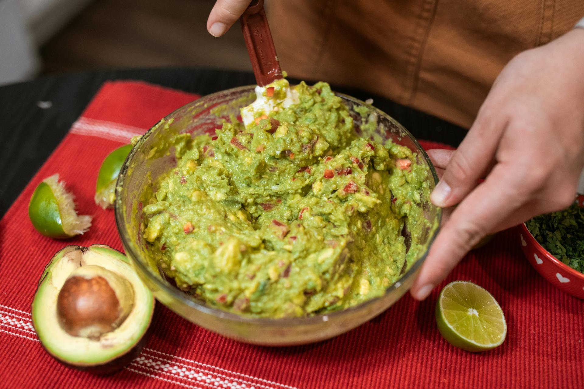 Close-up of a person preparing Guacamole | Source: Pexels