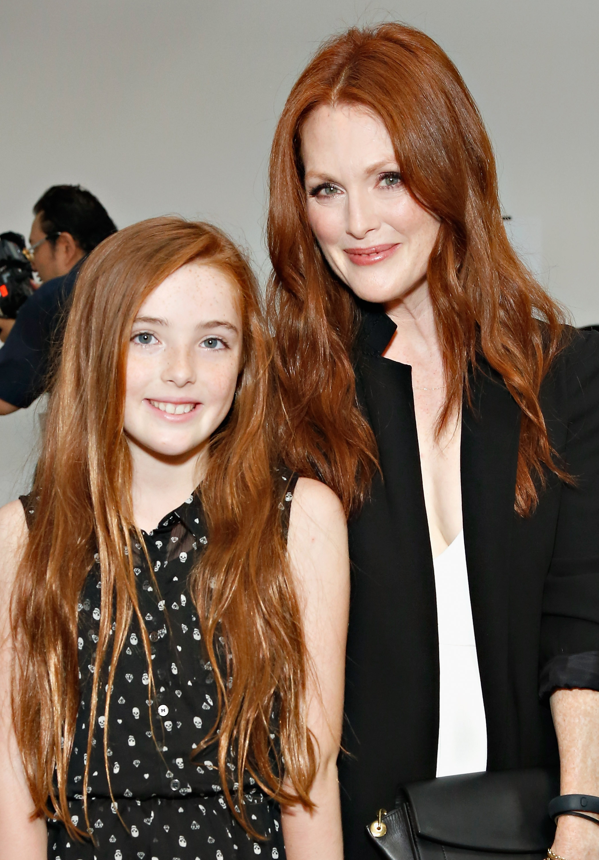 Liv Freundlich and Julianne Moore attend the Reed Krakoff fashion show on September 11, 2013 | Source: Getty Images