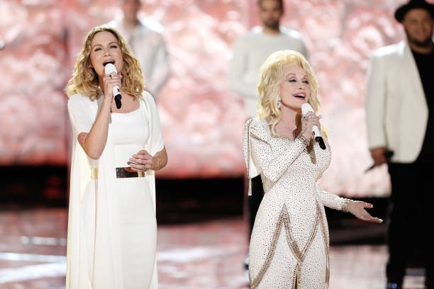 Jennifer Nettles and Dolly Parton at The Voice Holiday Celebration | Source: Tyler Golden/NBC/NBCU Photo Bank/Getty Images