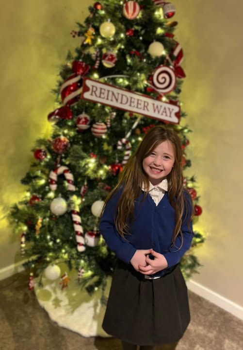 Nyla May Bradshaw in front of a Christmas tree shared on March 31, 2026 | Source: Facebook/Little Rainbows Doncaster Children's Autism Charity