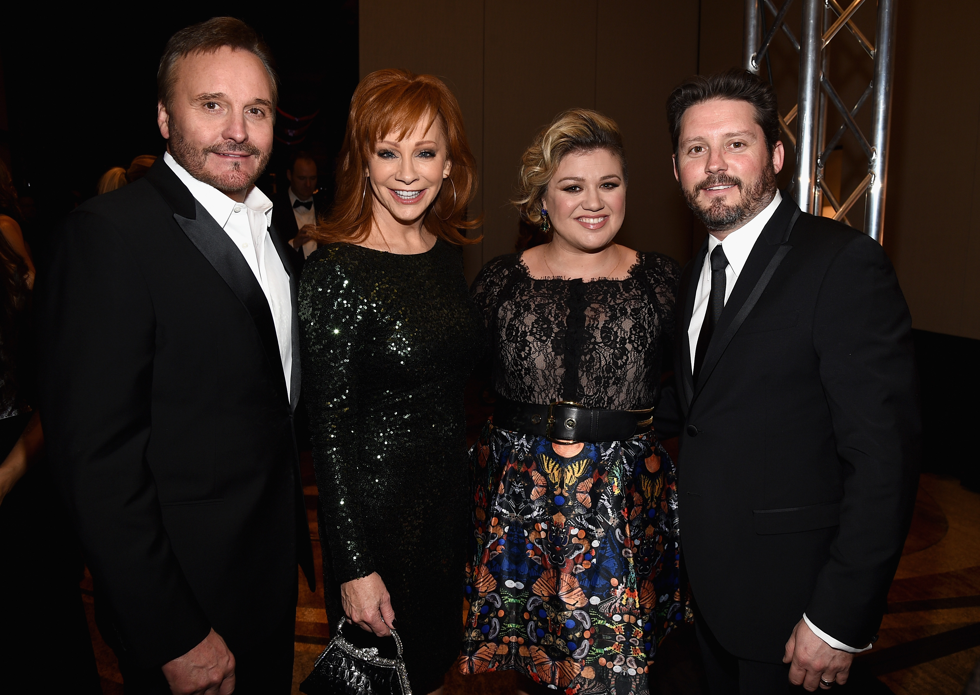 TV Producer Narvel Blackstock, singers Reba McEntire, Kelly Clarkson, and Brandon Blackstock attend Muhammad Ali's Celebrity Fight Night XXI at the JW Marriott Phoenix Desert Ridge Resort & Spa on March 28, 2015, in Phoenix, Arizona | Source: Getty Images