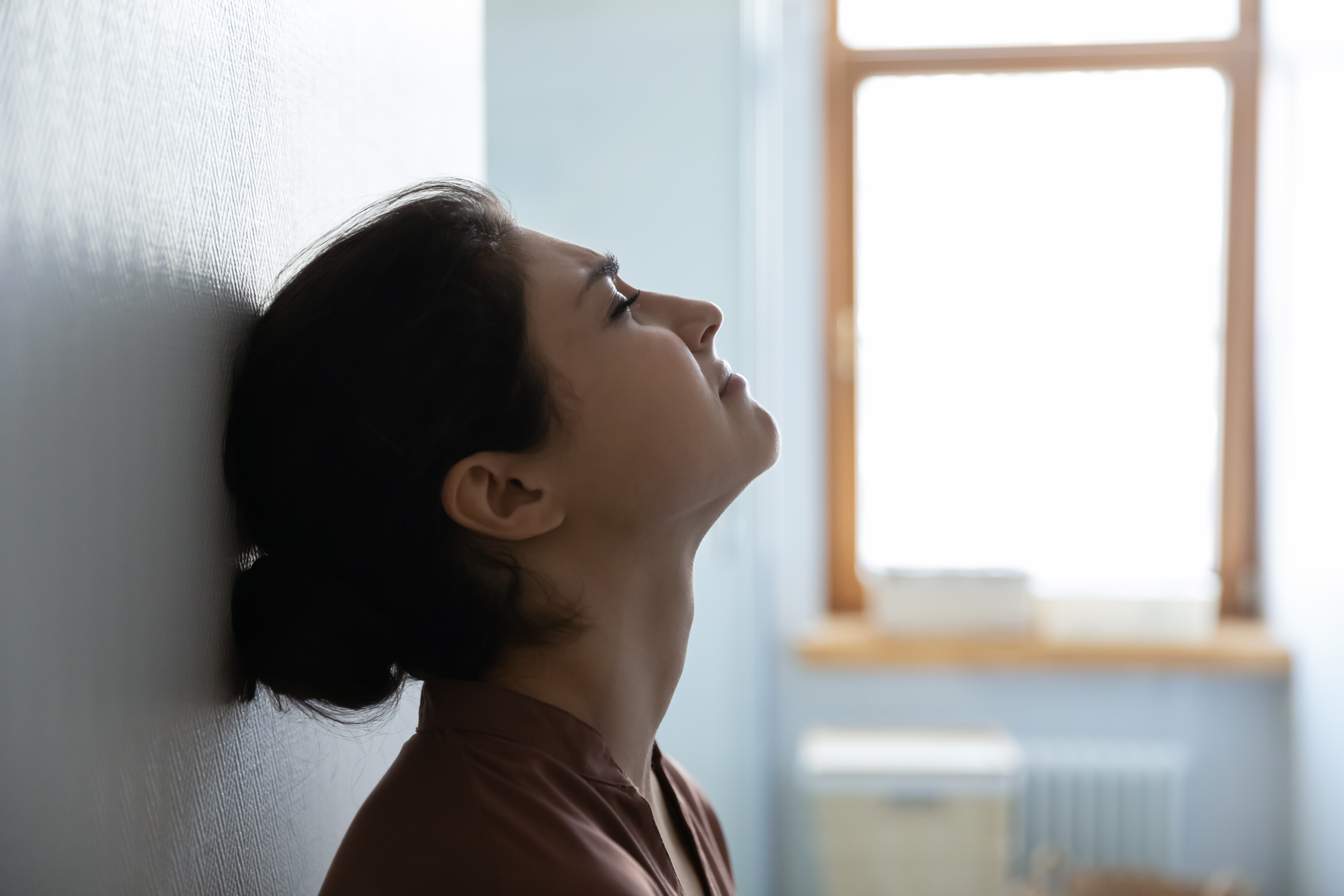 Nervous woman is waiting in hospital wall | Source: Shutterstock.com