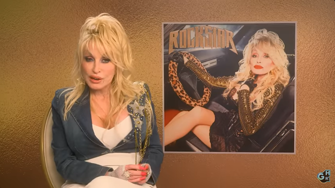 A screenshot of Dolly Parton discussing her work ethic and approach to business during a "Greatest Hits Radio" interview in July 2023. | Source: YouTube/GreatestHitsRadioUK