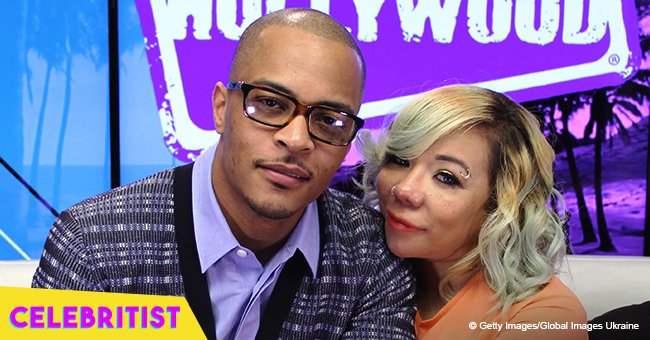 T.I. hugs look-alike daughters Deyjah and Heiress during show viewing party