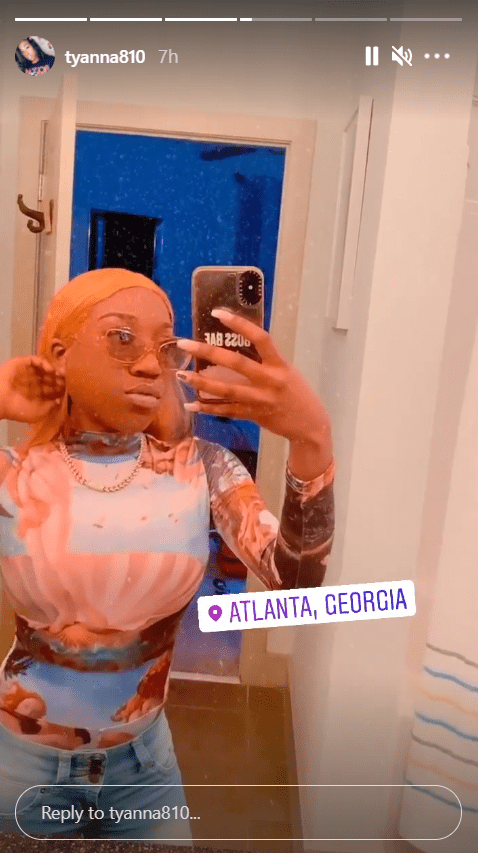 T'yanna Wallace poses in a mirror selfie sporting a renaissance-print turtleneck. | Photo: Instagram/tyanna180