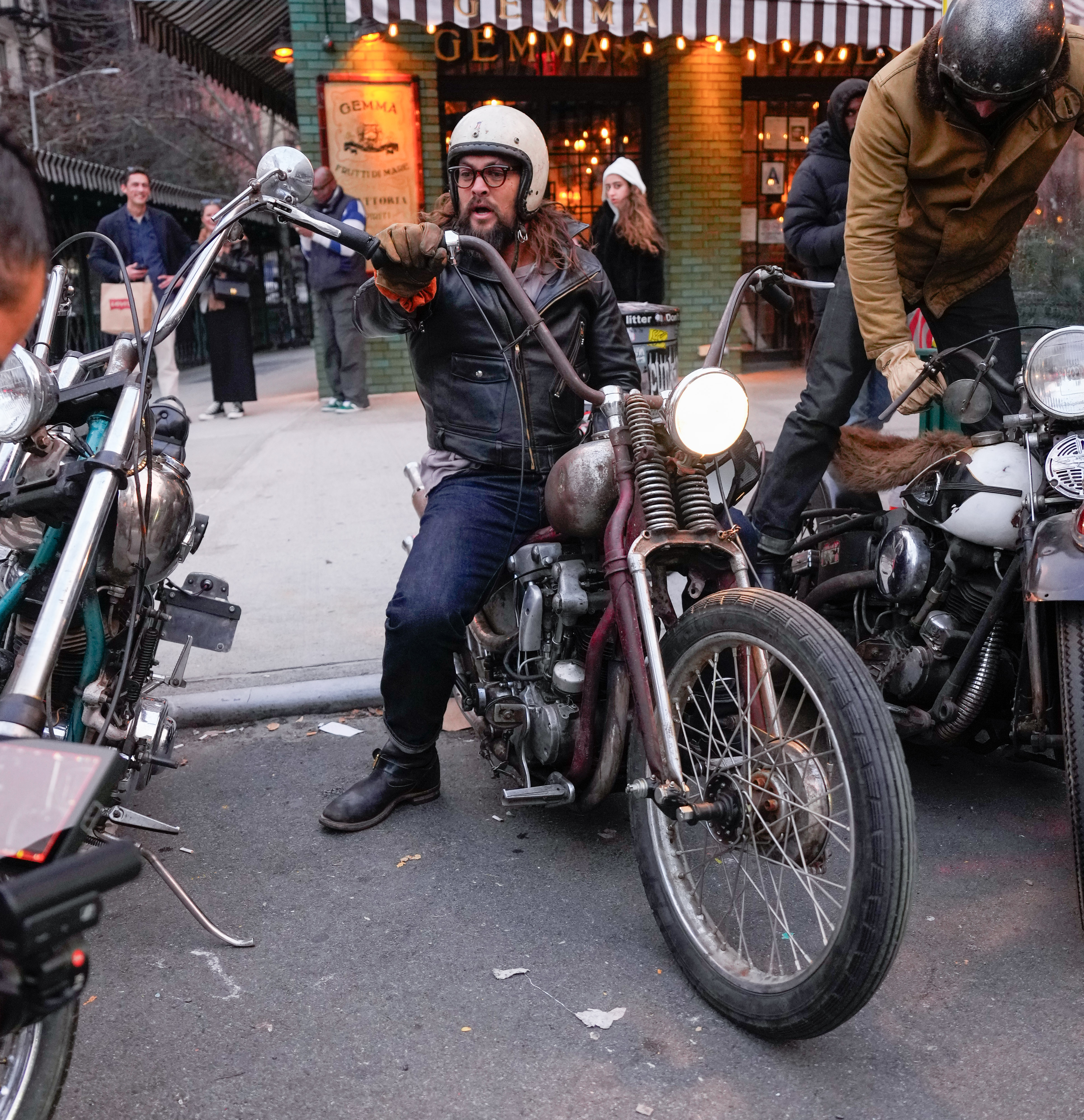 Jason Momoa riding a motorcycle in New York City on November 13, 2023. | Source: Getty Images