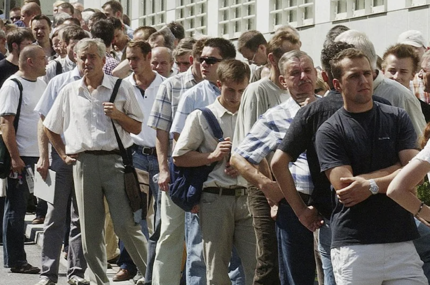 Lots of men in the line on the street | Source: Pexels
