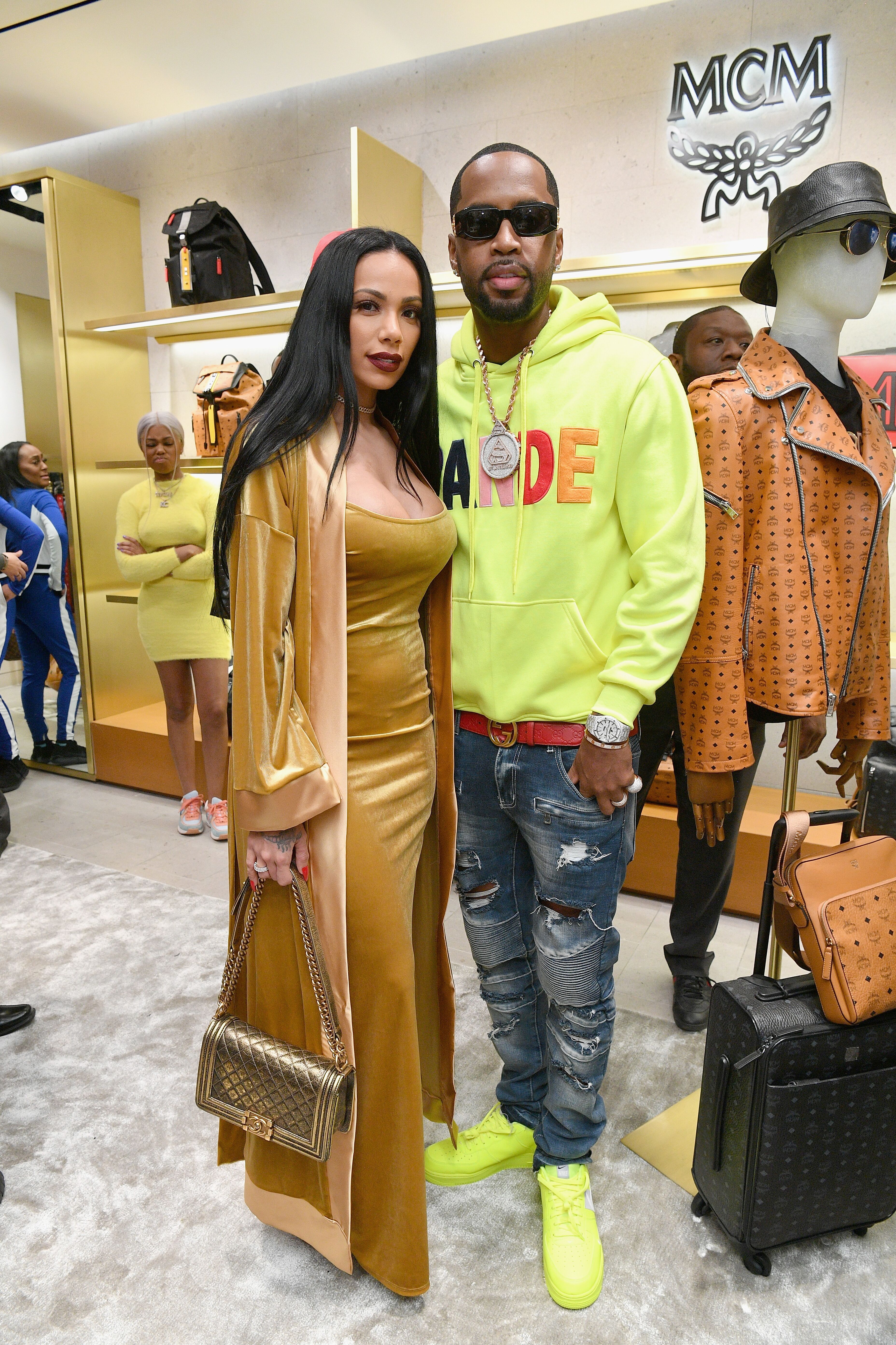 Safaree Samuels and Erica Mena shoping at MCM/ Source Getty Images