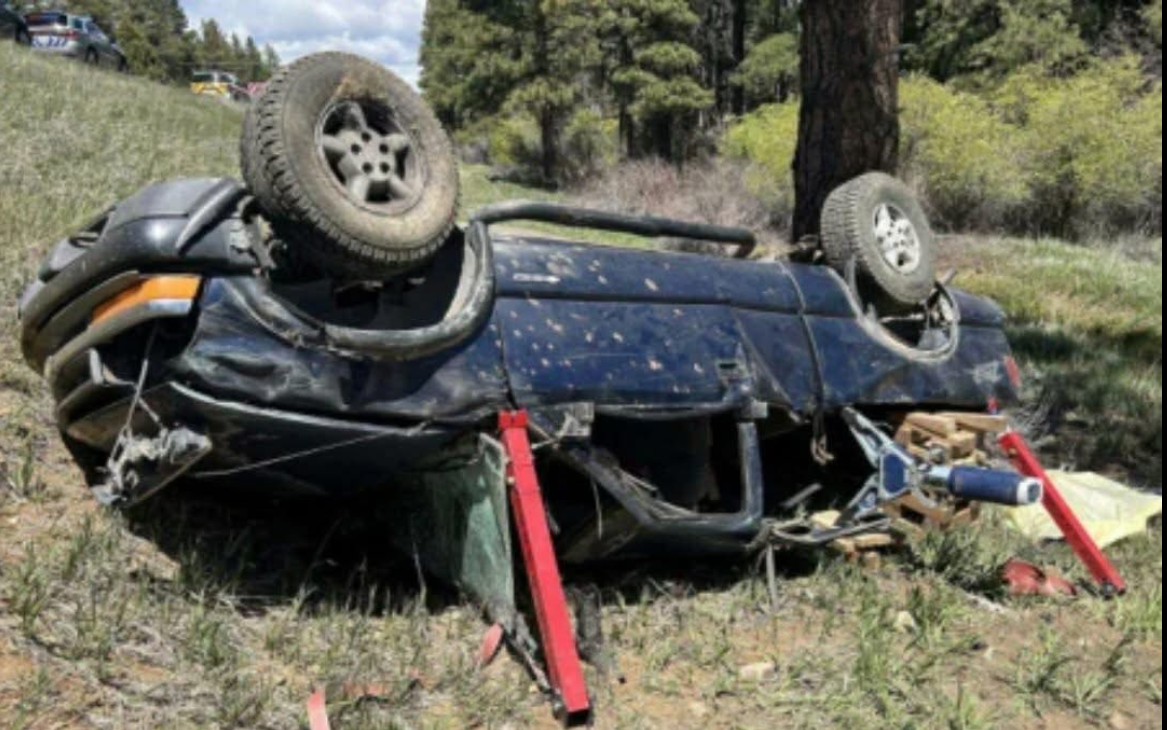 The blue Chevrolet S-10 pickup truck lies overturned in a grassy embankment after veering off the road. | Source: Facebook/Jade Charde