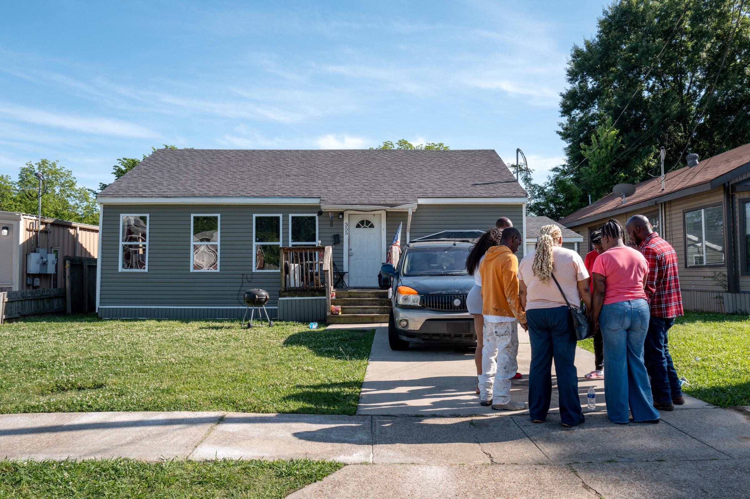 Family members gather outside a Shreveport home following a deadly shooting, April 19, 2026 | Source: Getty Images