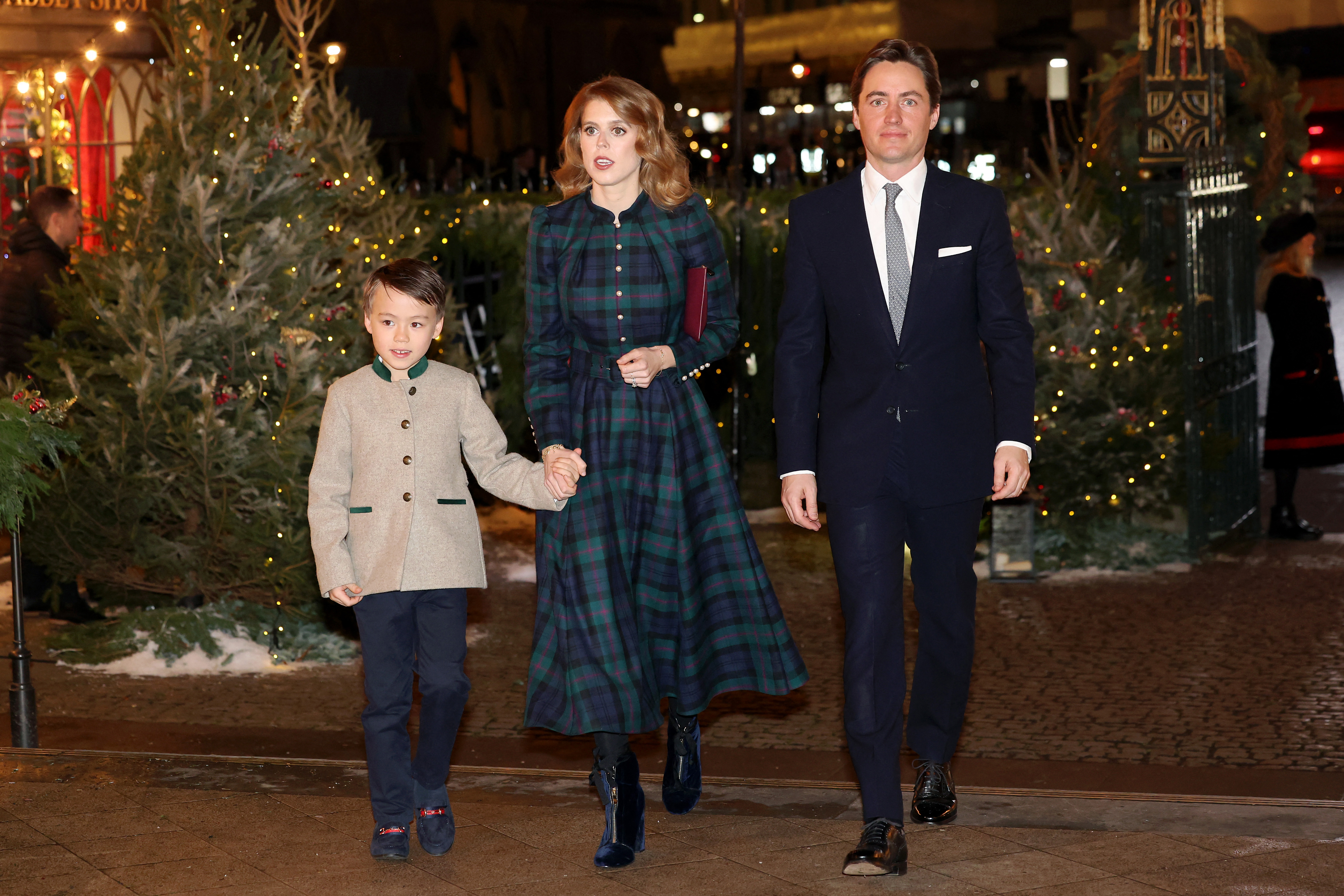 Christopher Woolf Mapelli Mozzi walks hand in hand with Princess Beatrice of York, accompanied by her husband, Edoardo Mapelli Mozzi, at the "Together At Christmas" Carol Service at Westminster Abbey on December 8, 2023, in London. | Source: Getty Images
