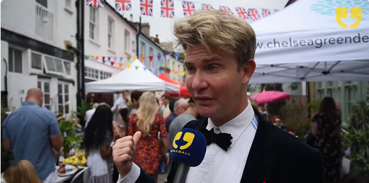 Ben Duncan is clearly delighted by the scene at the street party, as seen in a video post dated June 18, 2018. | Source: YouTube/WinkBallInterviews