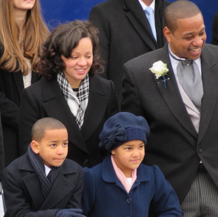Justin and Cerina Fairfax stand with their children during a formal event in a posed family photo | Source: Facebook/justin.fairfax.2025