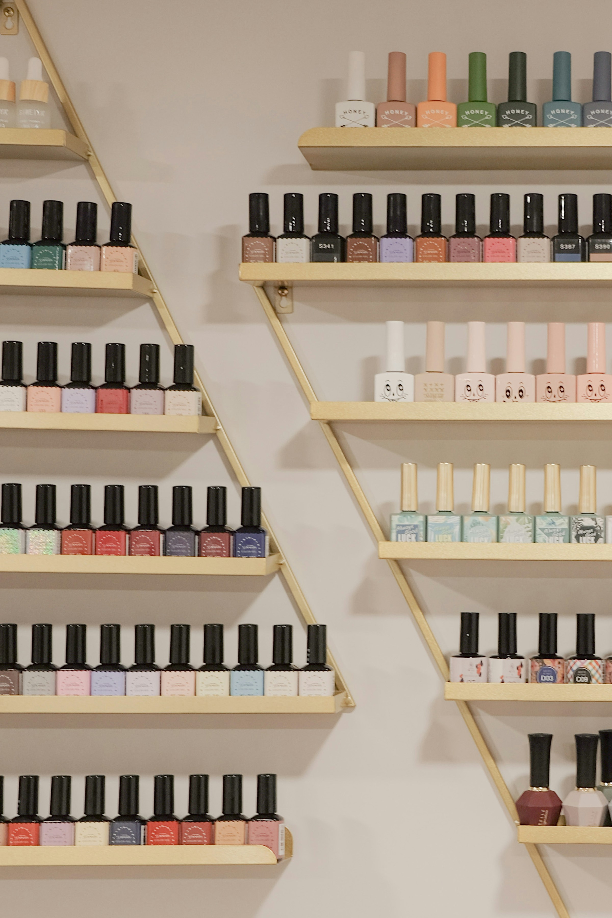 Different nail polish colors on shelves | Source: Unsplash