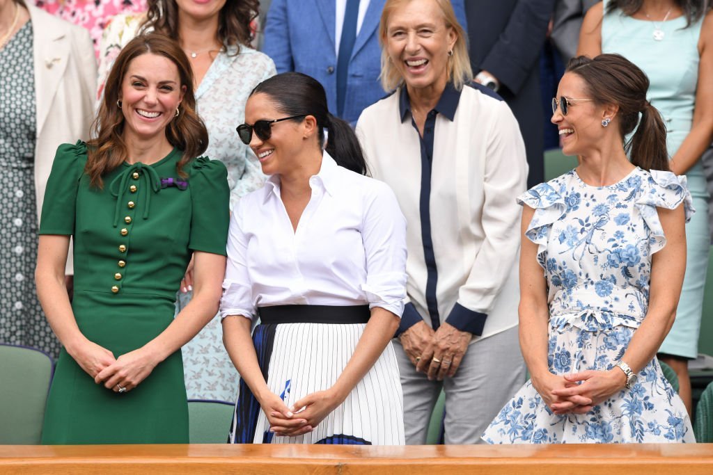 Kate Middleton, Martina Navratilova, Meghan Markle, and Pippa Middleton in the Royal Box on Centre Court during day twelve of the Wimbledon Tennis Championships at All England Lawn Tennis and Croquet Club | Photo: Getty Images