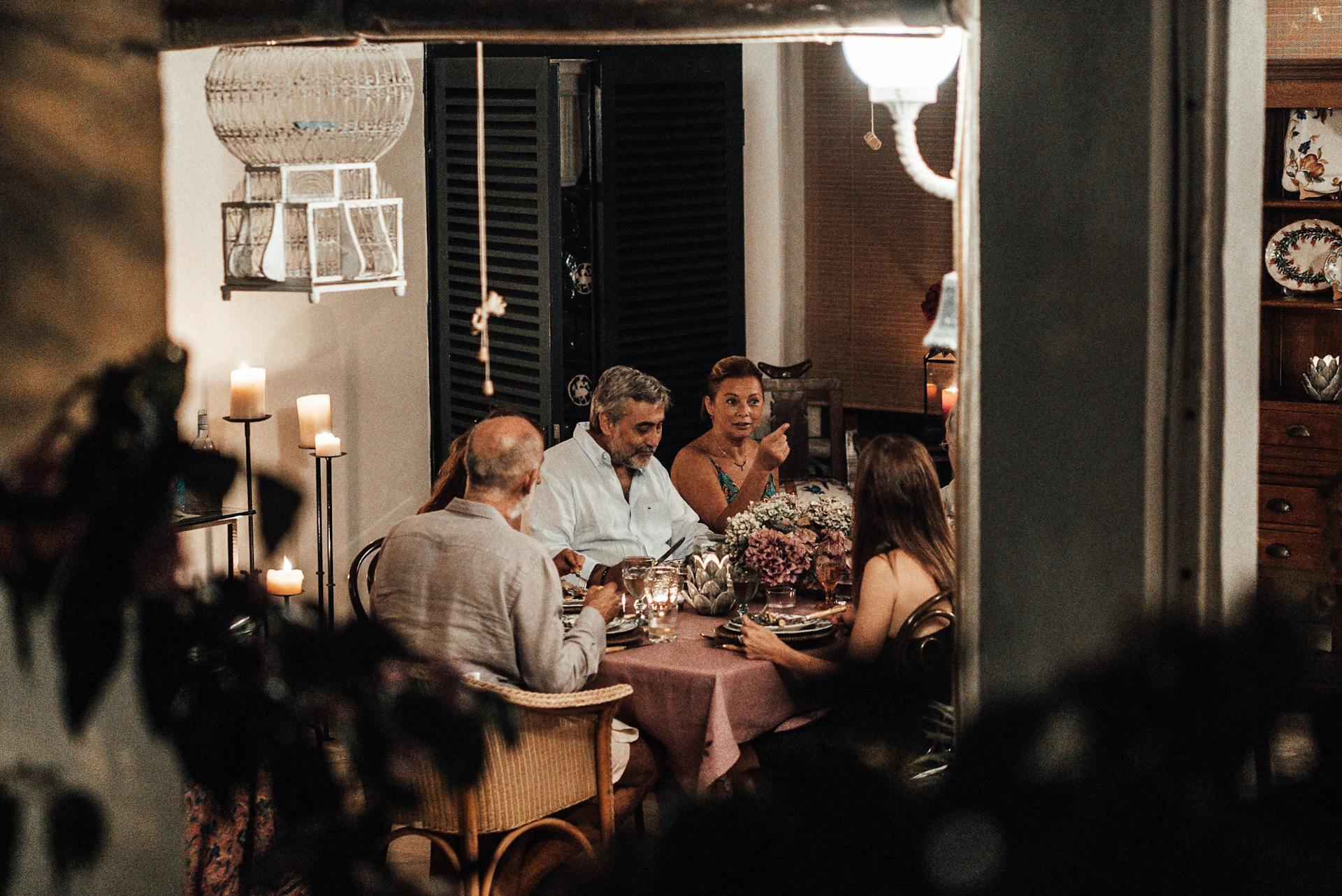 A group of people sitting at the dining table together | Source: Pexels