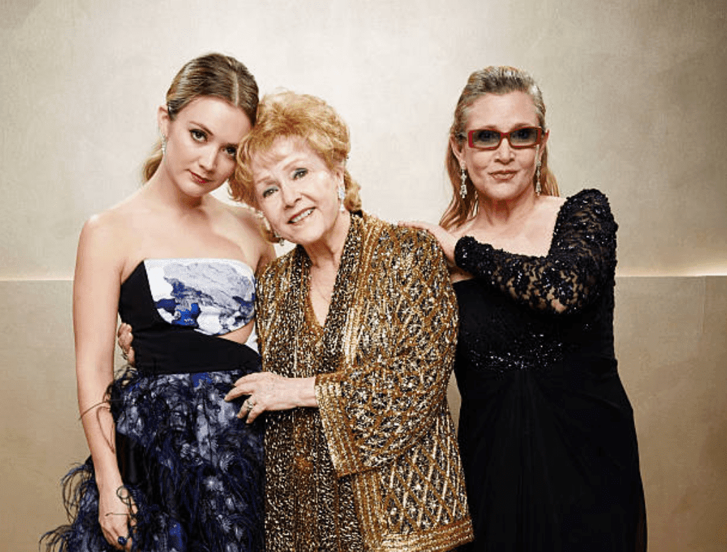 Billie Lourd, Carrie Fisher and Debbie Reynolds pose as a family on the red carpet for TNT's 21st Annual Screen Actors Guild Awards on January 25, 2015, in Los Angeles, California | Source: Getty Images (Photo by Kevin Mazur/WireImage)