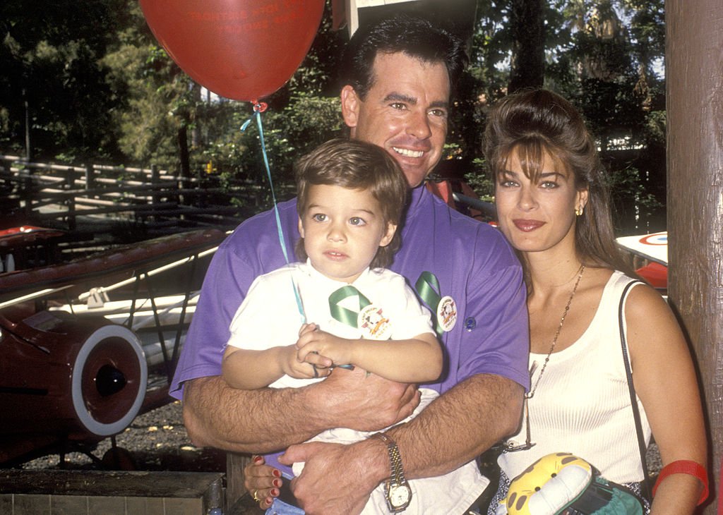 Kristian Alfonso, Michael Palumbo, and her son Gino Macauley at the "Happy Birthday, Camp Snoop!" on April 25, 1993, in California | Source: Getty Images
