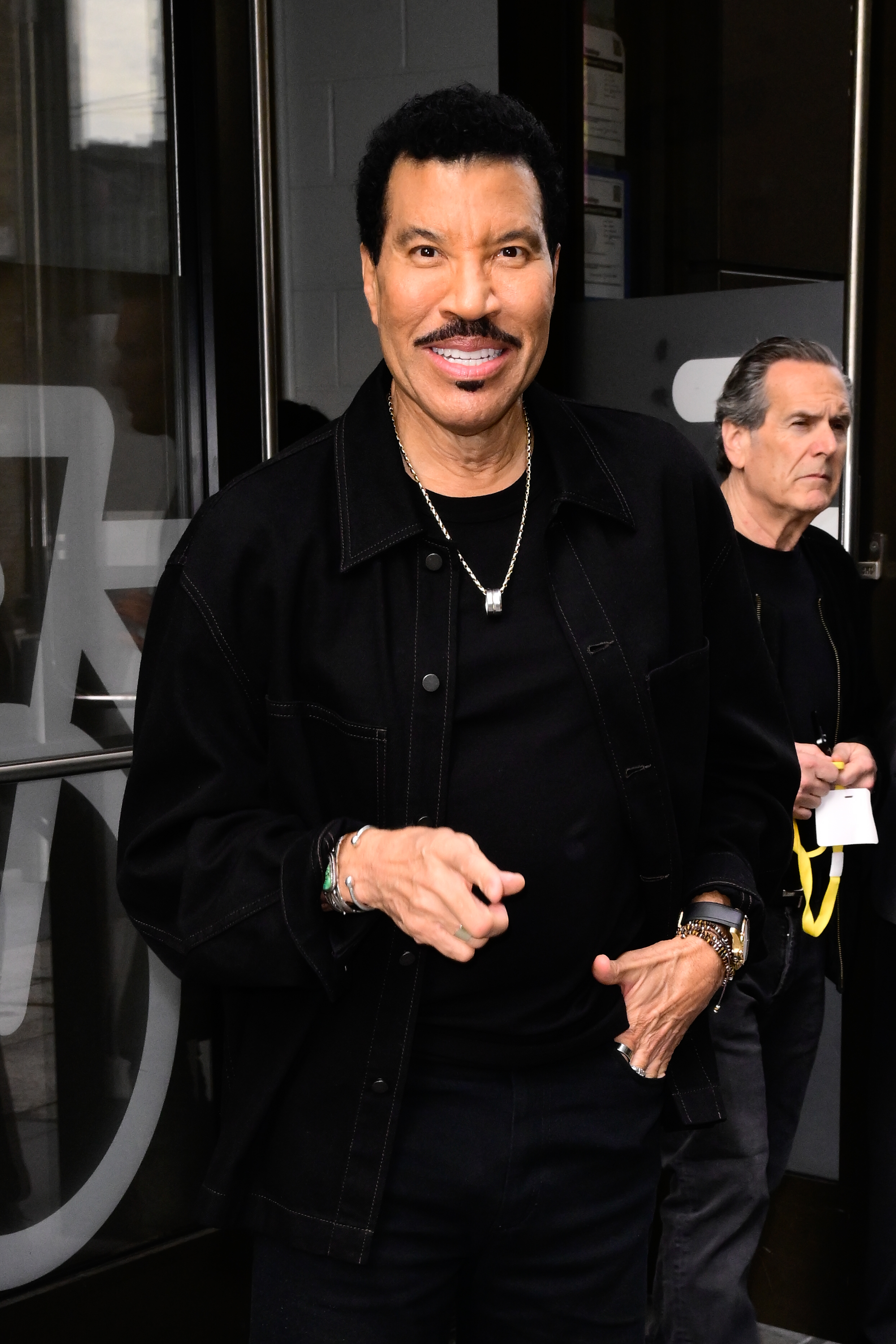 Richie, also 76, brought an entirely different kind of energy while arriving at ABC Studio in New York. Dressed in a sleek black jacket and a bold silver chain, he looked like a man still fully in his showman era. With his signature mustache and a touch of flair, Richie proved that charisma doesn't fade — it just finds new ways to shine.