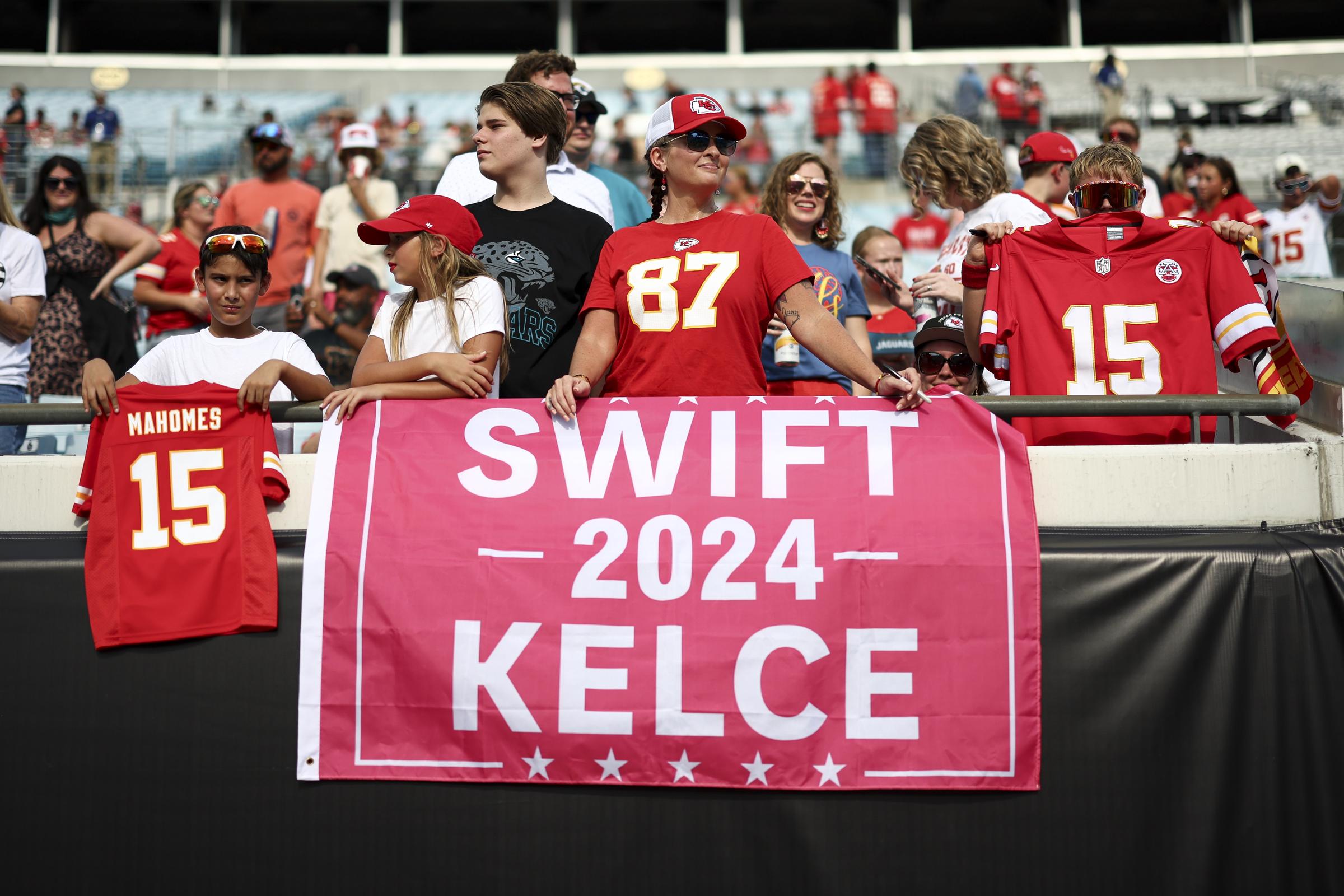 A Kansas City Chiefs fan with a sign for Taylor Swift and Travis Kelce during an NFL preseason football game at EverBank Stadium on August 10, 2024, in Jacksonville, Florida | Source: Getty Images