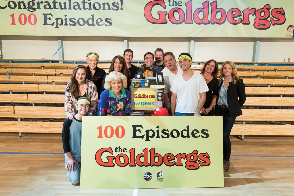 "The Goldbergs" cast pose for a photo at event celebrating the 100th episode. | Source: Getty Images