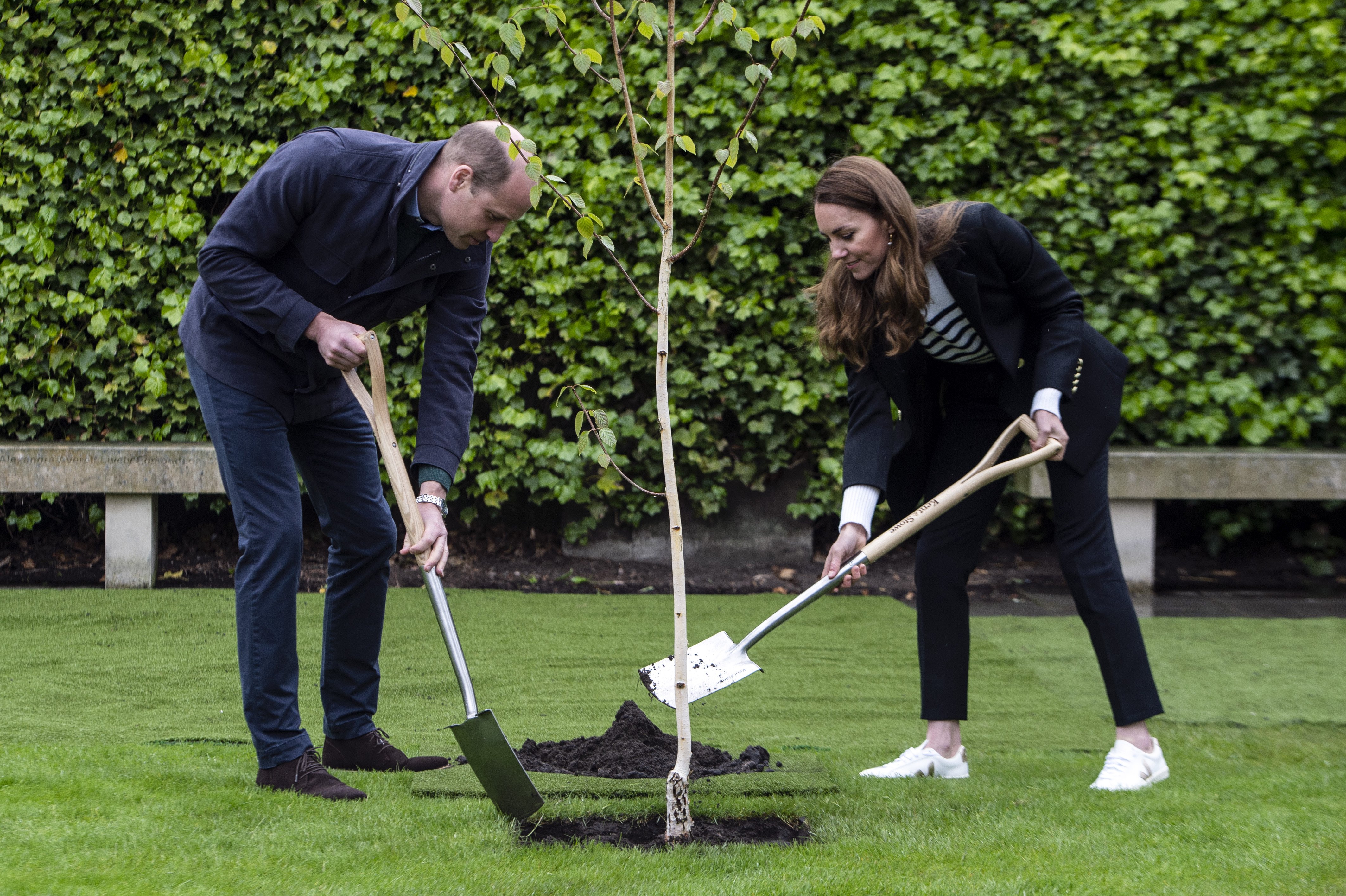 Prince William and Kate Middleton partaking in planting a tree during a visit to the University of St Andrews on May 26, 2021 in St Andrews, Scotland. / Source: Getty Images