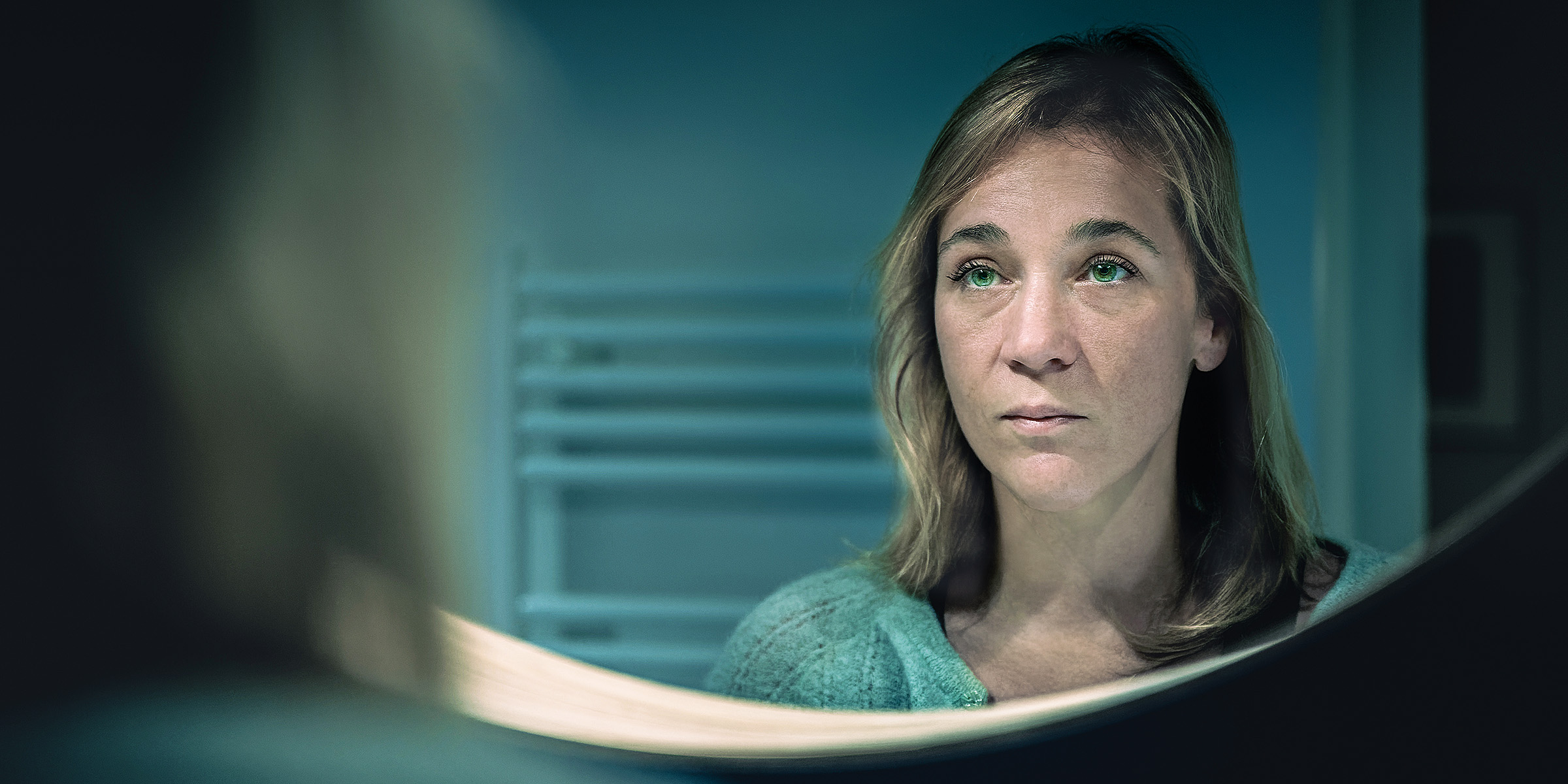 A woman staring at herself in her bathroom mirror | Source: Getty Images