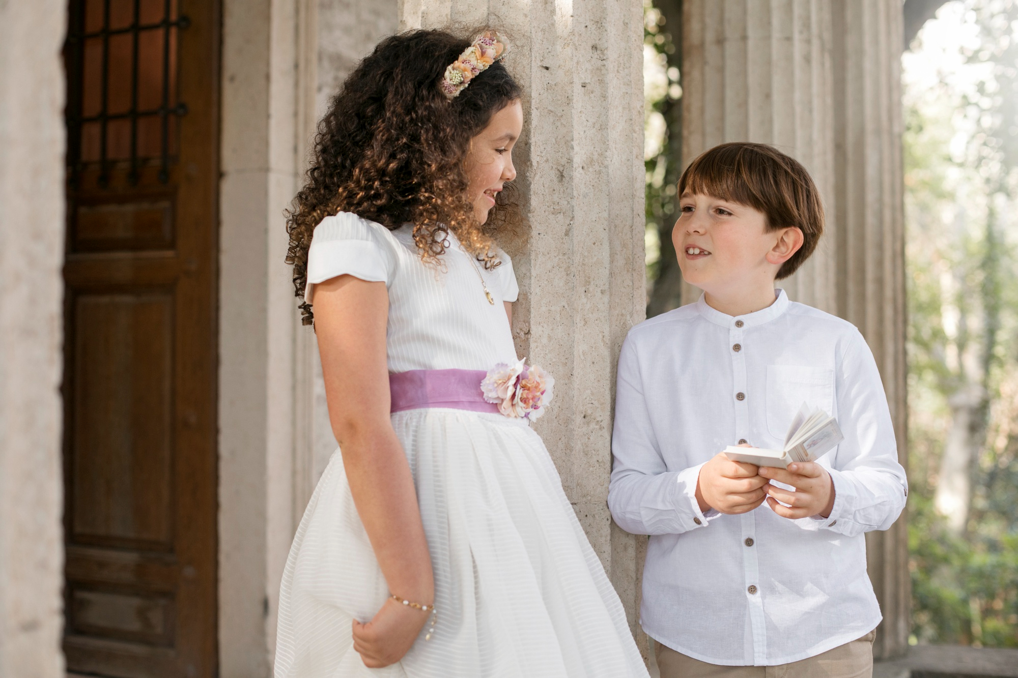 A little boy and girl at an event | Source: Freepik