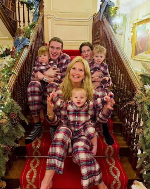Penny Lancaster poses in matching holiday pajamas with her sons, Alastair and Aiden Stewart, alongside three of Rod Stewart's grandchildren on January 13, 2026. | Source: Instagram/penny.lancaster