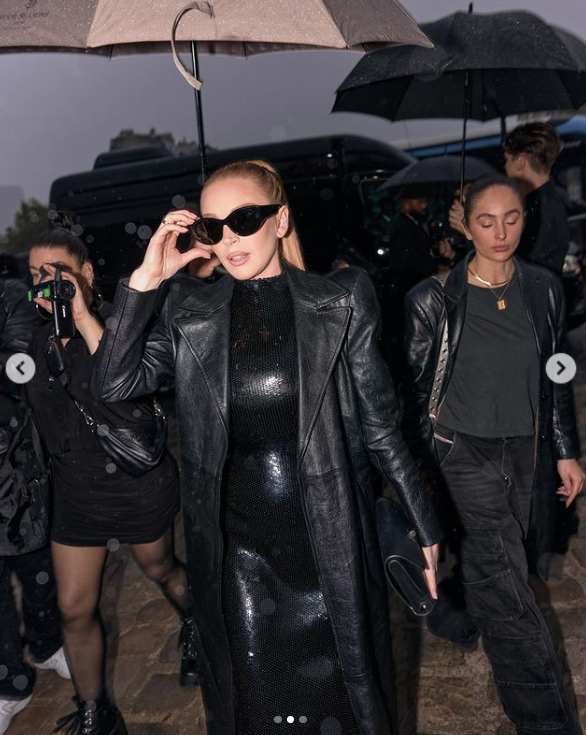 A closer look at Lindsay Lohan's all-black outfit during Paris Fashion Week, shared in October 2024 | Source: Instagram.com/lindsaylohan