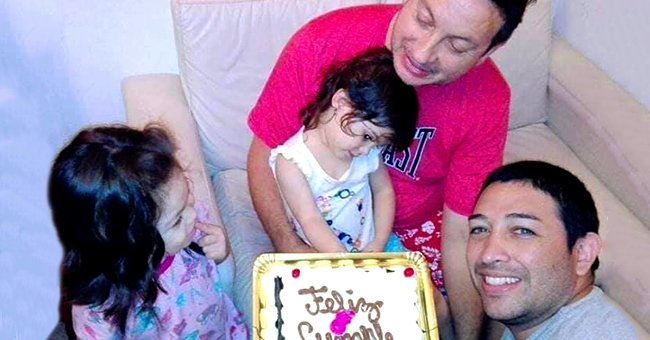 Damian Pighin (in pink shirt) and Ariel Vijarra pictured celebrating the birthday of one of their adoptive daughters. | Source: facebook.com/avijarra