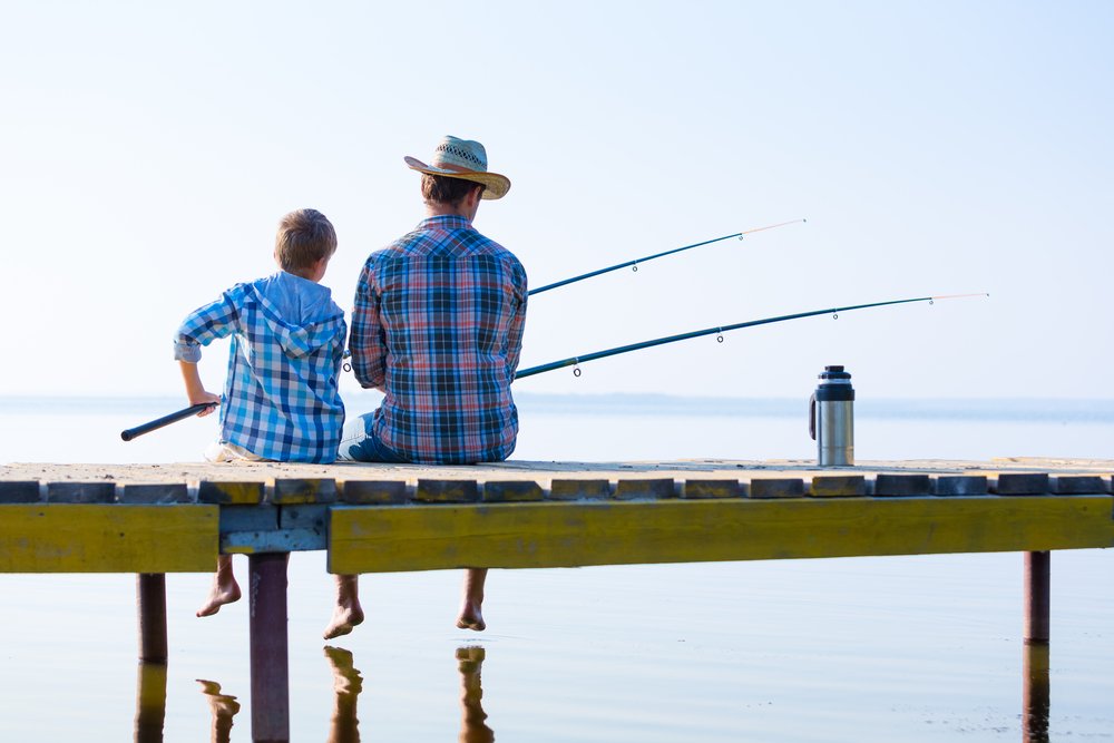 A man and his son go fishing together | Photo: Shutterstock
