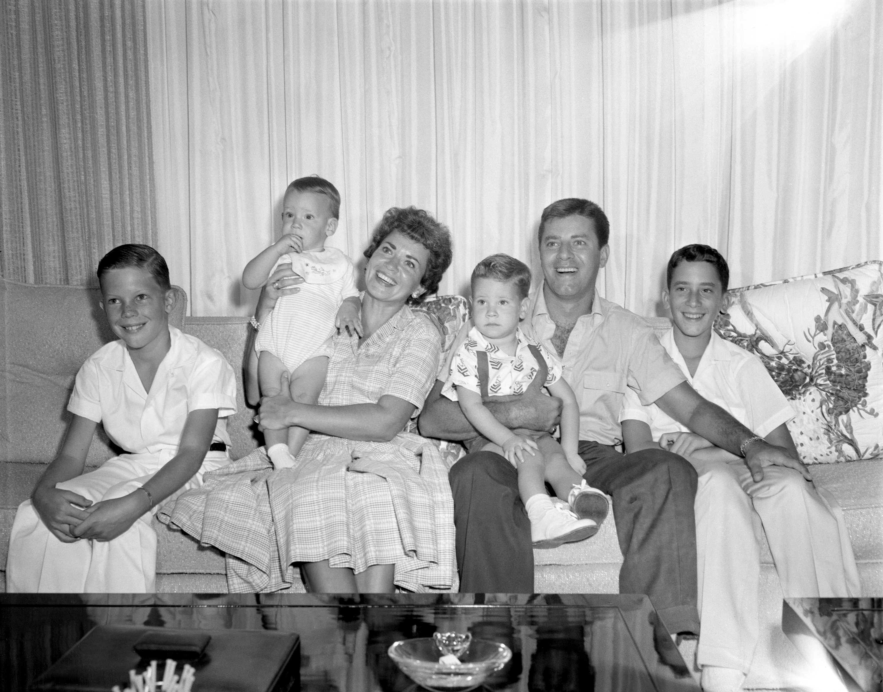 Comedian Jerry Lewis, his wife Patti and four sons, (left to right) Ronald, Christopher, Scott, and Gary, for an episode of the CBS celebrity interview program 'Person to Person,' California, September 1958. | Source: Getty Images