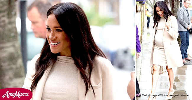 Meghan Markle flashes toned legs and cradles her huge baby-bump while visiting an animal shelter