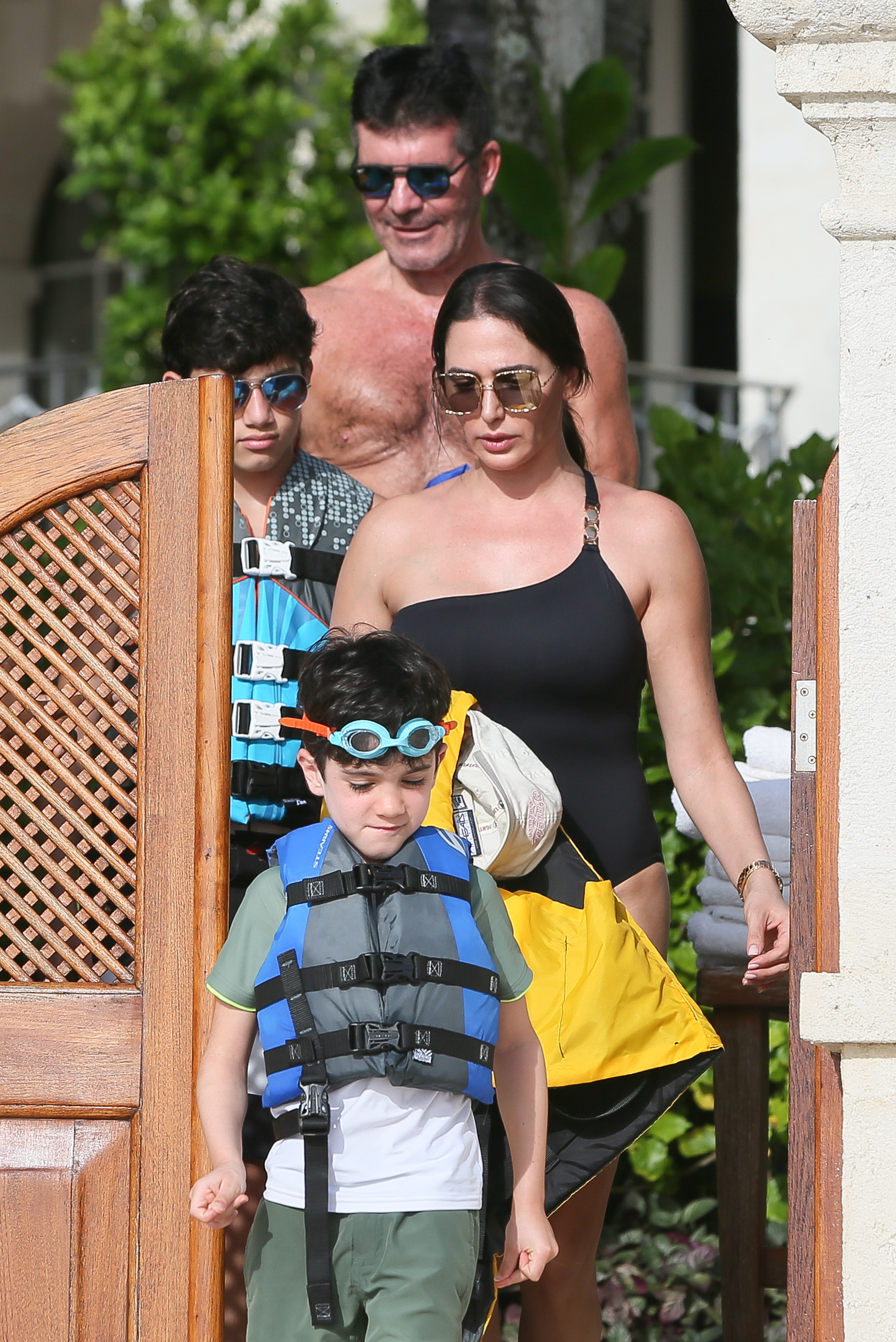 Simon Cowell and Lauren Silverman, with sons Adam and Eric, are seen in Barbados on December 20, 2019 | Source: Getty Images