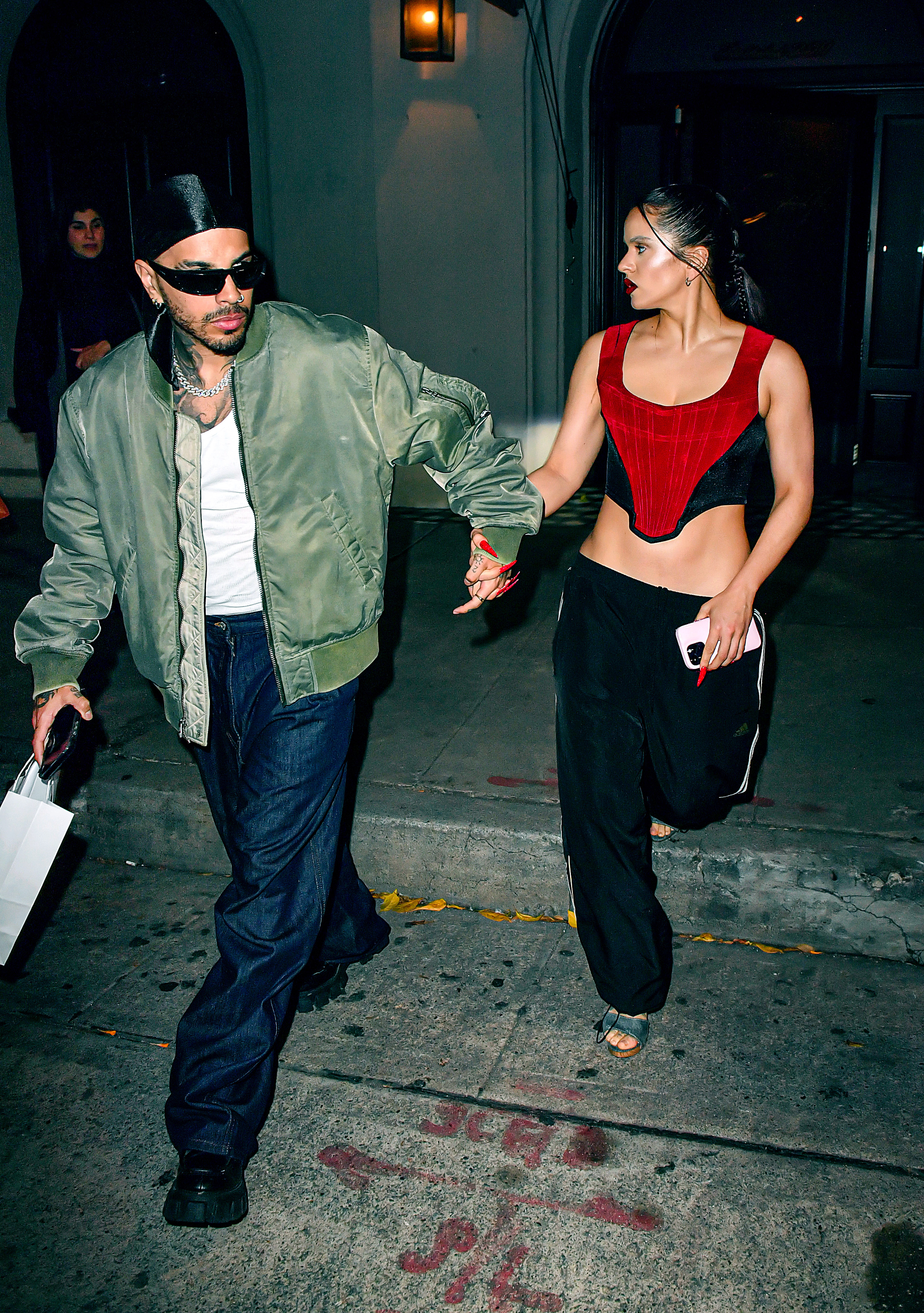 Rauw Alejandro and Rosalía are seen leaving Craig's, on April 18, 2023, in Los Angeles, California. | Source: Getty Images