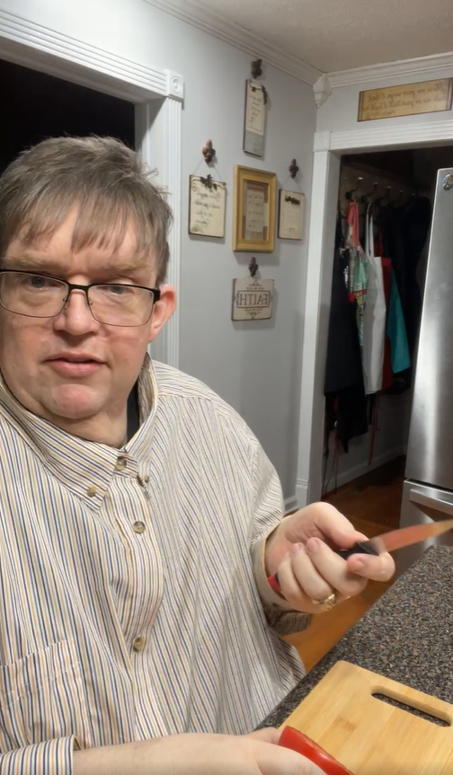 John Davis speaks to viewers while preparing the recipe during the livestream. For followers, it looked like another ordinary episode of Coffee Time with John and Momma. | Source: Facebook/coffeetimewithjohnandmomma