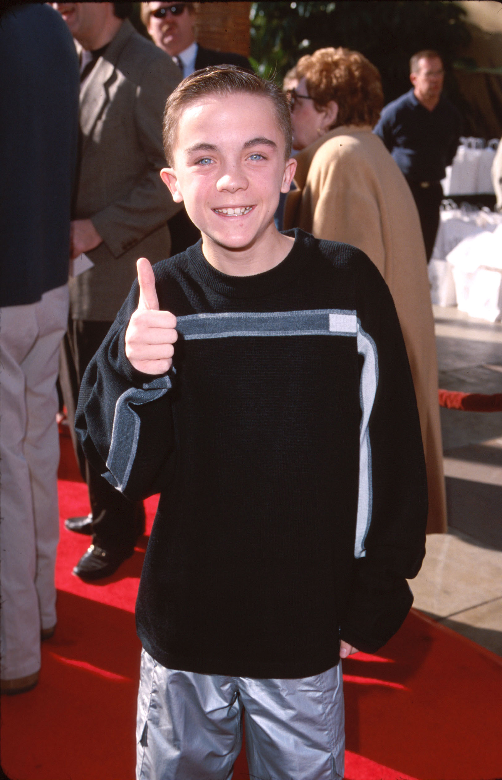 In 2000, Muniz was all smiles and spiky hair as the breakout star of “Malcolm in the Middle.” Rocking a color-block sweater and silver pants on the red carpet, he had just become one of the most recognizable child actors on television, with a sharp wit that defined the early 2000s sitcom era.