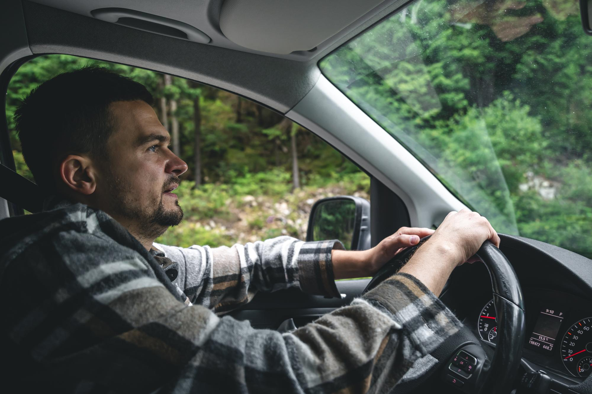 A man driving away | Source: Freepik