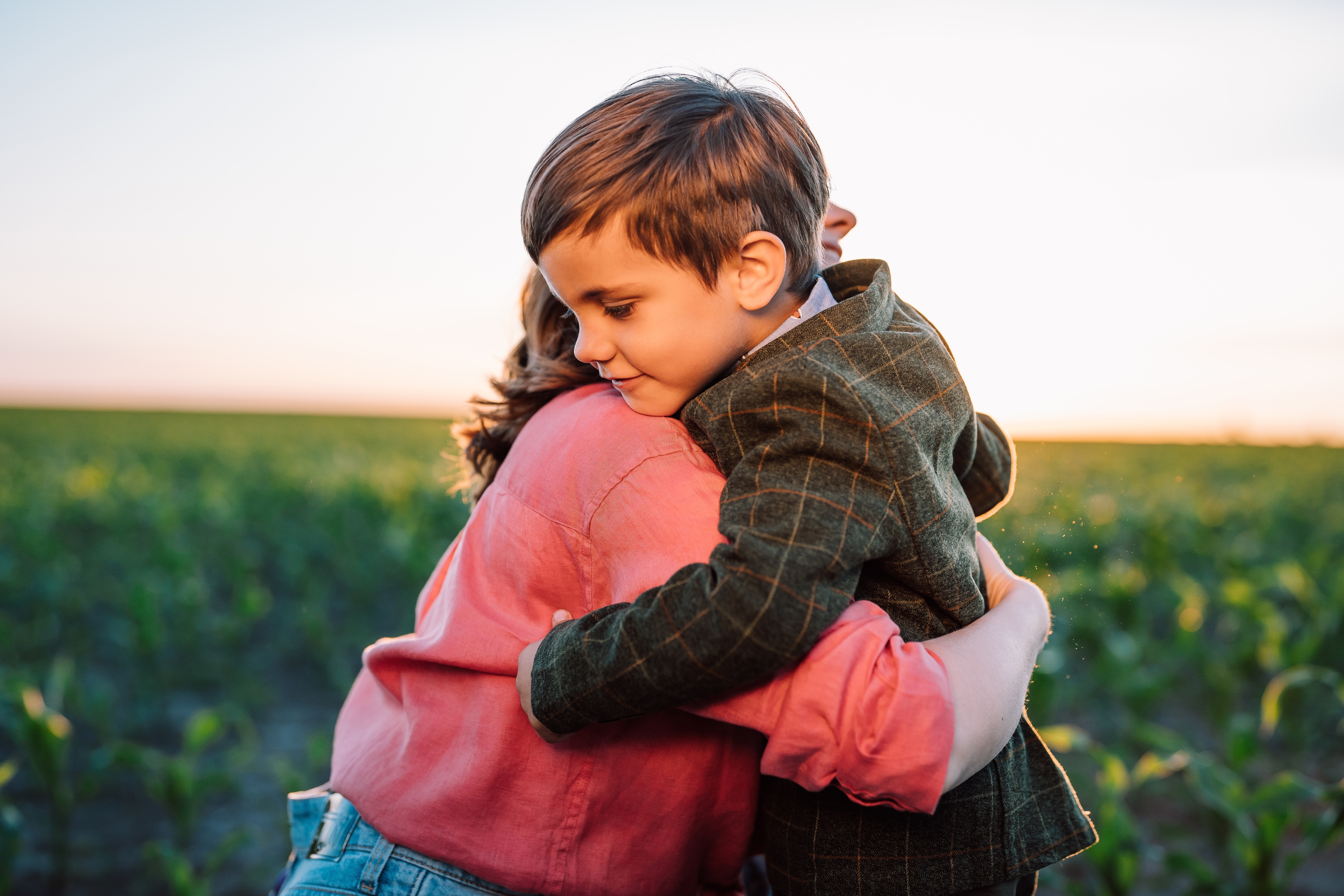 Boy hugs his mother | Source: Shutterstock.com