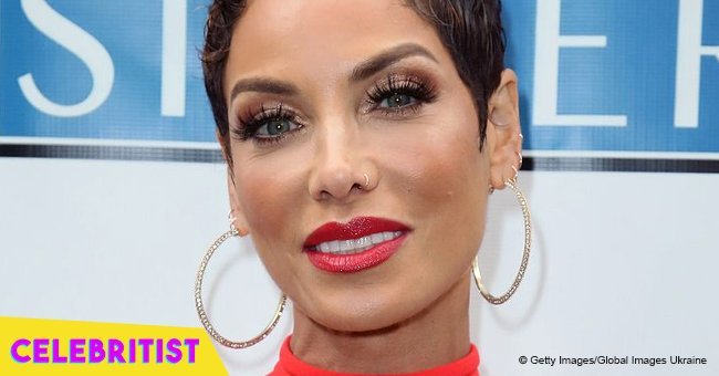 Nicole Murphy puts her curves on display in colorful swimsuit